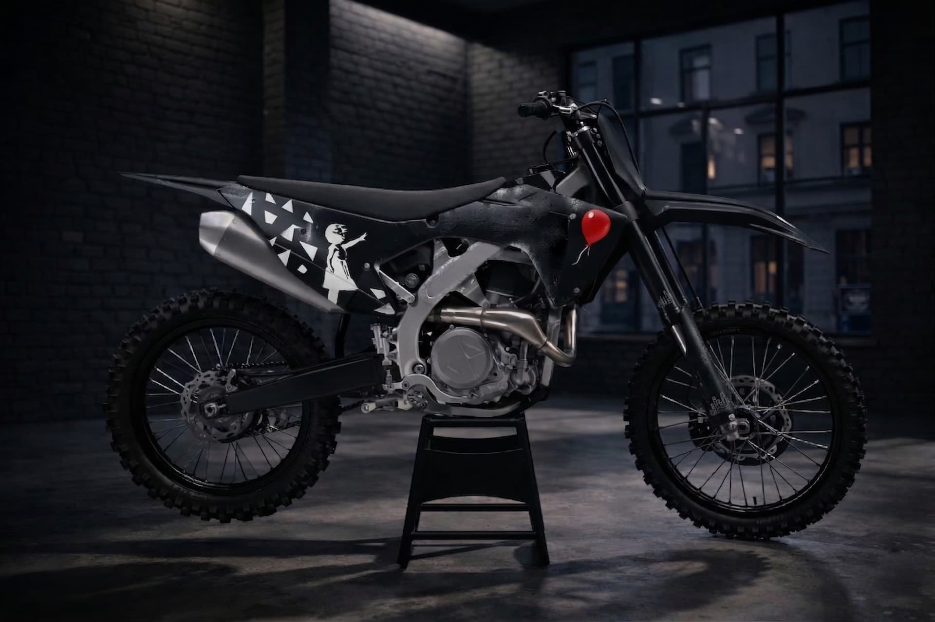 Minimal black custom dirt bike graphics with red balloon stencil accent.